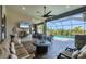 Inviting screened lanai features an outdoor living area, dining space, and a summer kitchen at 14398 Fort Worth Cir, Port Charlotte, FL 33981