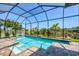 Beautiful pool is enclosed with a screened lanai, which overlooks a picturesque canal at 14398 Fort Worth Cir, Port Charlotte, FL 33981