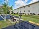 Park-like setting with benches, barbeque grills, and bike racks at 1531 Placida Rd # 202 Building 9, Englewood, FL 34223