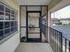 Screened balcony with views of the condo complex and landscaping at 1531 Placida Rd # 202 Building 9, Englewood, FL 34223