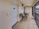 Balcony with tile flooring, outdoor seating, and a charming coastal vibe at 1531 Placida Rd # 202 Building 9, Englewood, FL 34223