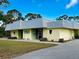 Exterior view of the Lemon Bay Playhouse, a local theater with a vibrant yellow facade at 1531 Placida Rd # 202 Building 9, Englewood, FL 34223