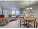Spacious living and dining area featuring tile floors, comfortable seating, and a stylish dining set at 1531 Placida Rd # 202 Building 9, Englewood, FL 34223