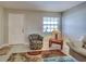 Inviting living room with tile floors, a cozy chair, and bright natural light at 1531 Placida Rd # 202 Building 9, Englewood, FL 34223