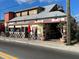 Charming restaurant with outdoor seating and colorful signage for 