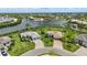 Beautiful aerial shot of luxurious waterfront homes, featuring manicured lawns and serene water views at 15336 Spanish Point Dr, Port Charlotte, FL 33981