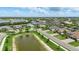 An aerial view of a luxurious community with waterfront properties and well-manicured landscaping at 15336 Spanish Point Dr, Port Charlotte, FL 33981