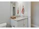 Bathroom featuring a granite vanity and decorative mirror at 15336 Spanish Point Dr, Port Charlotte, FL 33981