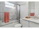 Full bathroom with granite vanity, shower, and white cabinets at 15336 Spanish Point Dr, Port Charlotte, FL 33981