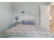 Bedroom with a decorative white headboard and light gray walls at 15336 Spanish Point Dr, Port Charlotte, FL 33981