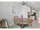 Dining area with a round table that looks into the kitchen with stainless steel appliances at 15336 Spanish Point Dr, Port Charlotte, FL 33981