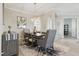 Inviting dining room with statement lighting, comfortable seating, and sophisticated decor at 15336 Spanish Point Dr, Port Charlotte, FL 33981