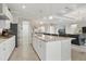 Well-equipped kitchen with a granite island, modern appliances, and an open layout at 15336 Spanish Point Dr, Port Charlotte, FL 33981