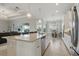 Bright, open kitchen with large island, modern appliances, and seamless flow to living spaces at 15336 Spanish Point Dr, Port Charlotte, FL 33981