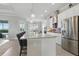 Modern kitchen with stainless steel appliances, granite countertops, and a large island at 15336 Spanish Point Dr, Port Charlotte, FL 33981