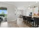 Spacious kitchen and dining area leading to an outdoor patio with a pool at 15336 Spanish Point Dr, Port Charlotte, FL 33981