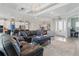 Bright living room with a modern open concept, lots of natural light, and stylish furnishings at 15336 Spanish Point Dr, Port Charlotte, FL 33981