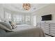 Bedoom suite with a large bed that looks out through shuttered windows at 15336 Spanish Point Dr, Port Charlotte, FL 33981