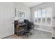 Home office area with a window, a modern desk and rolling chair at 15336 Spanish Point Dr, Port Charlotte, FL 33981