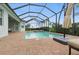 Lovely brick paver pool deck includes a screened lanai, perfect for outdoor entertaining at 15336 Spanish Point Dr, Port Charlotte, FL 33981