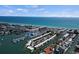 Breathtaking aerial view showcases waterfront living with boat docks and nearby pristine sandy beach at 1555 Tarpon Center Dr # G 235, Venice, FL 34285