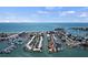 Stunning aerial captures coastal homes, boat docks, and immediate beach access for idyllic waterfront lifestyle at 1555 Tarpon Center Dr # G 235, Venice, FL 34285