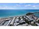 Aerial showcases the desirable coastal location, nestled near white sandy beaches, and easy ocean access at 1555 Tarpon Center Dr # G 235, Venice, FL 34285
