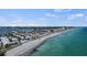 Stunning aerial view of beachfront property with clear blue waters and sandy coastline at 1555 Tarpon Center Dr # G 235, Venice, FL 34285