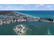 Scenic aerial shot of coastal community, showing beach access, boat docks and charming residential area at 1555 Tarpon Center Dr # G 235, Venice, FL 34285