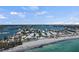Beautiful coastal community with beach access and waterfront views, under a partly cloudy sky at 1555 Tarpon Center Dr # G 235, Venice, FL 34285