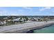 Luxury beachfront homes with pristine sand and clear ocean views from an aerial perspective at 1555 Tarpon Center Dr # G 235, Venice, FL 34285