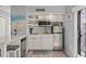 Modern kitchen with stainless steel appliances, subway tile backsplash, and efficient layout at 1555 Tarpon Center Dr # G 235, Venice, FL 34285