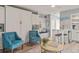 Open-concept living area with sleek furniture, integrated kitchen, and plenty of space for relaxation and dining at 1555 Tarpon Center Dr # G 235, Venice, FL 34285