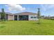 Expansive backyard with a screened lanai, perfect for outdoor enjoyment at 15963 Crofton Springs Way, Port Charlotte, FL 33953