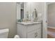 Bathroom with granite counter, white cabinets, and brushed nickel fixtures at 15963 Crofton Springs Way, Port Charlotte, FL 33953