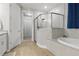 Beautiful bathroom with glass shower, soaking tub, and sleek fixtures at 15963 Crofton Springs Way, Port Charlotte, FL 33953