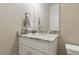 Bathroom with granite counter, white cabinets, and brushed nickel fixtures at 15963 Crofton Springs Way, Port Charlotte, FL 33953