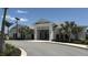 The community clubhouse boasts an inviting exterior and ample parking at 15963 Crofton Springs Way, Port Charlotte, FL 33953