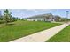 Landscaped yard and sidewalk leading up to the house at 15963 Crofton Springs Way, Port Charlotte, FL 33953