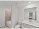 Bathroom featuring a bathtub and a vanity with white countertop at 17595 Opal Sand Dr # 205, Venice, FL 34293