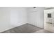 Bright bedroom featuring a closet and an ensuite bathroom with white cabinets at 17595 Opal Sand Dr # 205, Venice, FL 34293