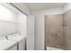 Laundry area with washer, dryer, and tiled wall at 17595 Opal Sand Dr # 205, Venice, FL 34293