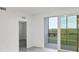 A bright living room featuring an outdoor view and light gray tile flooring at 17595 Opal Sand Dr # 205, Venice, FL 34293