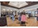 Retail store showcasing golf apparel, equipment and accessories with wooden floors at 17595 Opal Sand Dr # 205, Venice, FL 34293