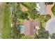Aerial view of home and property boundaries featuring a screened-in pool and mature trees at 188 Grand Oak Cir, Venice, FL 34292
