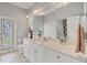 Bright bathroom with a double vanity, big mirror and good lighting at 188 Grand Oak Cir, Venice, FL 34292