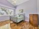 Bedroom with wood floors, ceiling fan and a window at 188 Grand Oak Cir, Venice, FL 34292