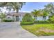 Beautiful single story home featuring lush landscaping and a long driveway at 188 Grand Oak Cir, Venice, FL 34292