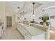 Spacious kitchen with white cabinets, countertops, and open layout, perfect for entertaining at 188 Grand Oak Cir, Venice, FL 34292