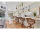 Open kitchen with bar seating overlooking the dining area and access to the pool at 188 Grand Oak Cir, Venice, FL 34292